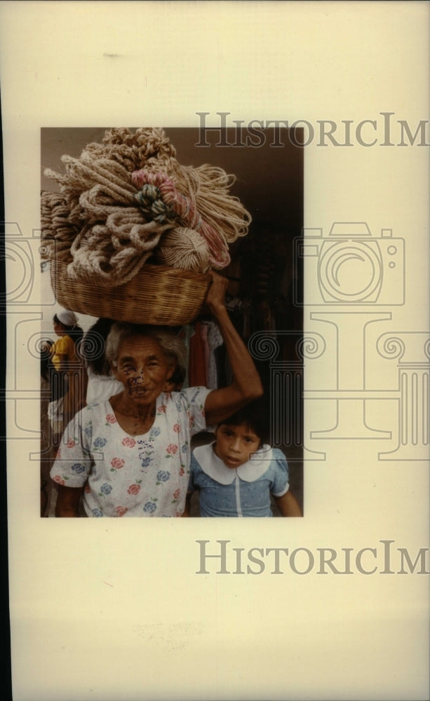 1983, Salvador Service Woman Carries Ropes - RRU17799 - Historic Images