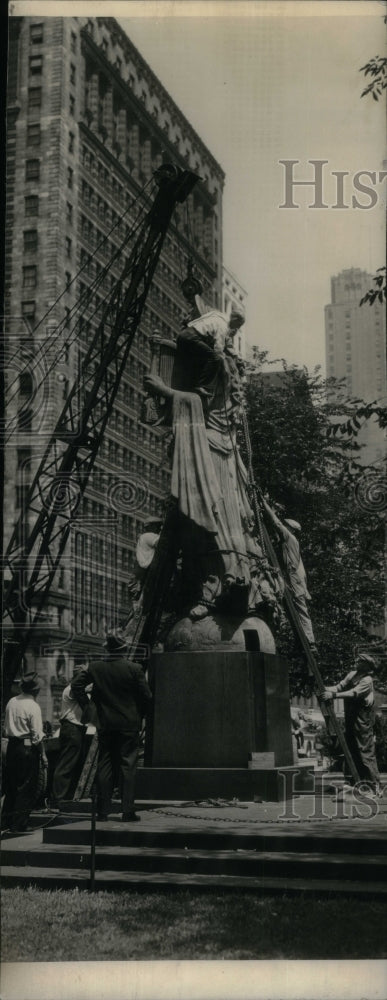 1941 Workmen take down Euterpe figure  - Historic Images