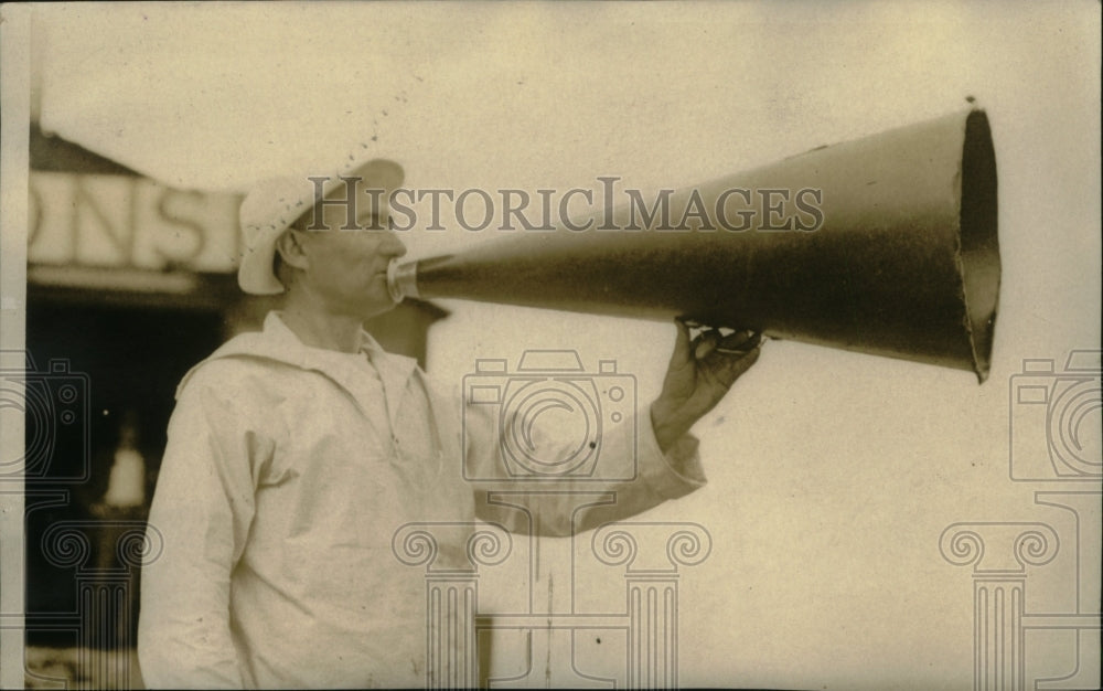 1911 Person announcing through megaphone - Historic Images