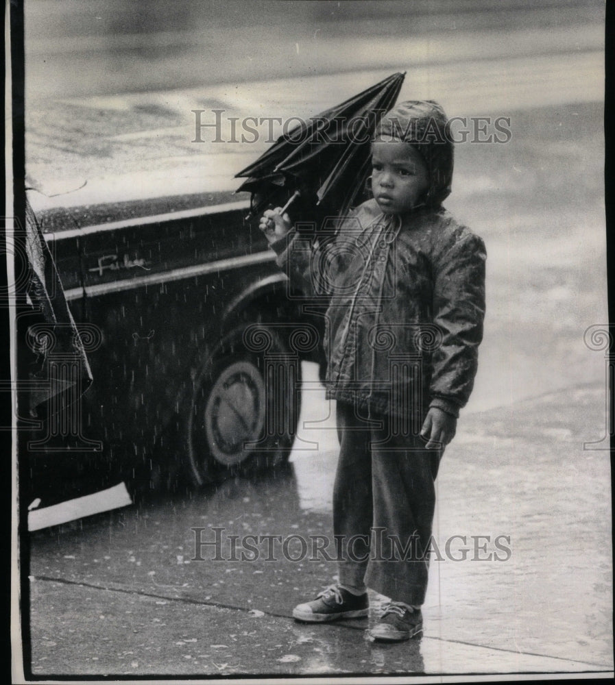 1972, Little Boy in the Rain Bad Umbrella - RRU38791 - Historic Images