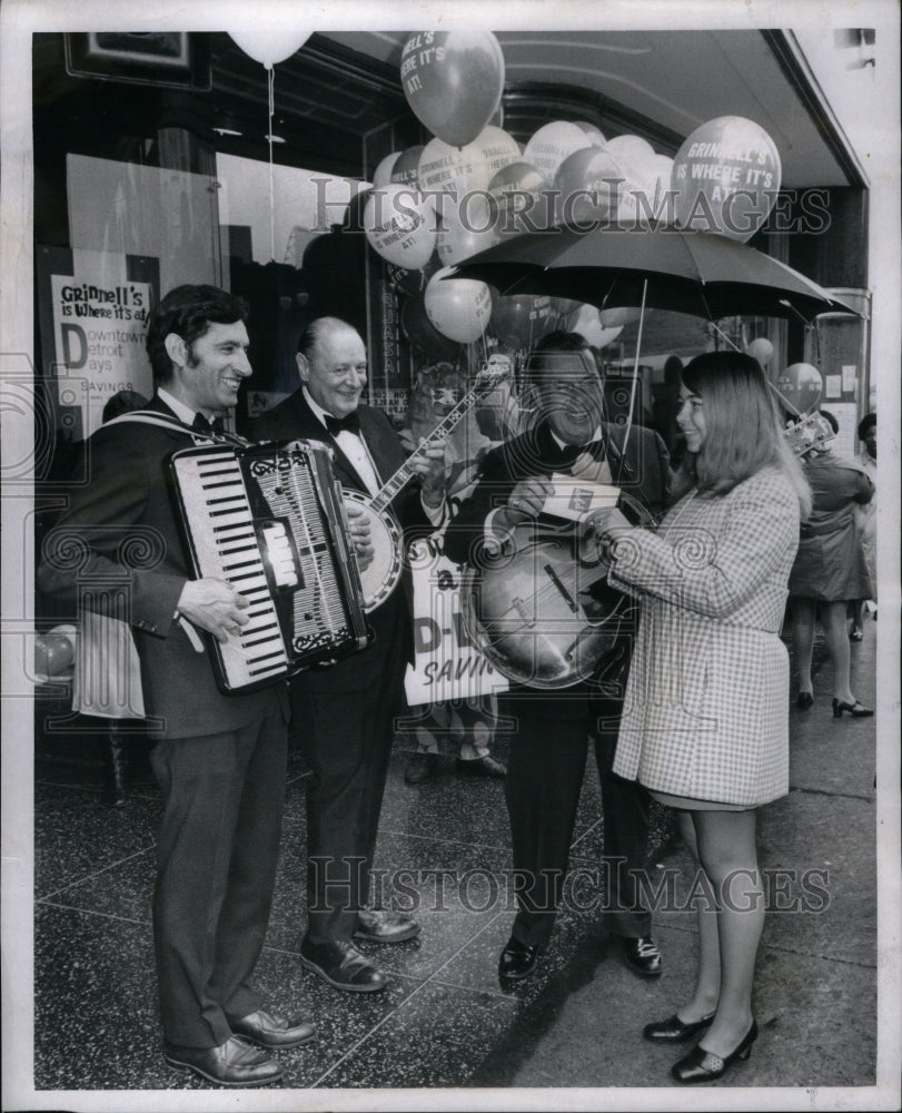 1970 Shopping  Examining Goods Selection - Historic Images