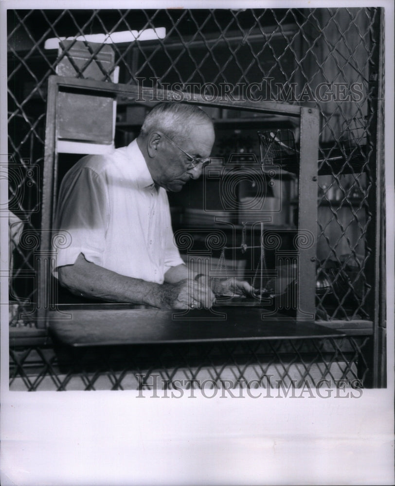 1963 Press Photo Man Weighing with Century-Old Scale - Historic Images