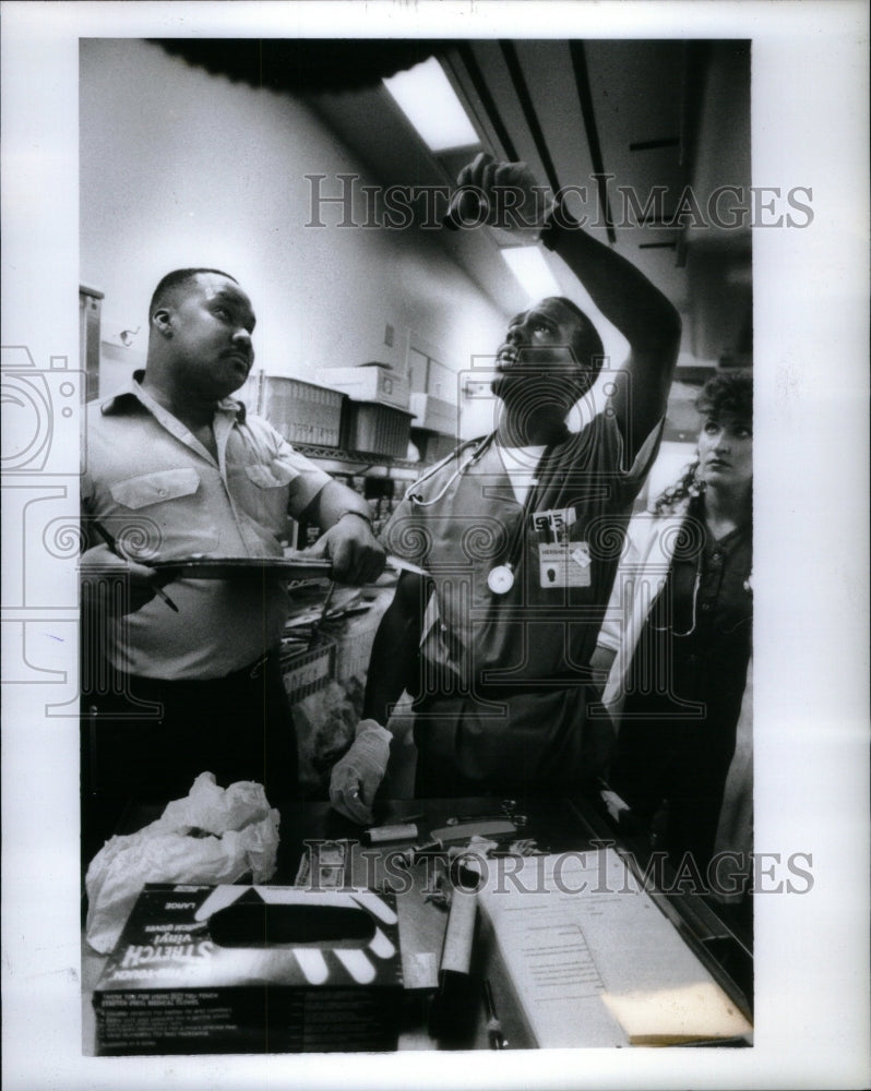 1990, Doctor Robert Hill Trauma Patient Wipe - RRU45137 - Historic Images