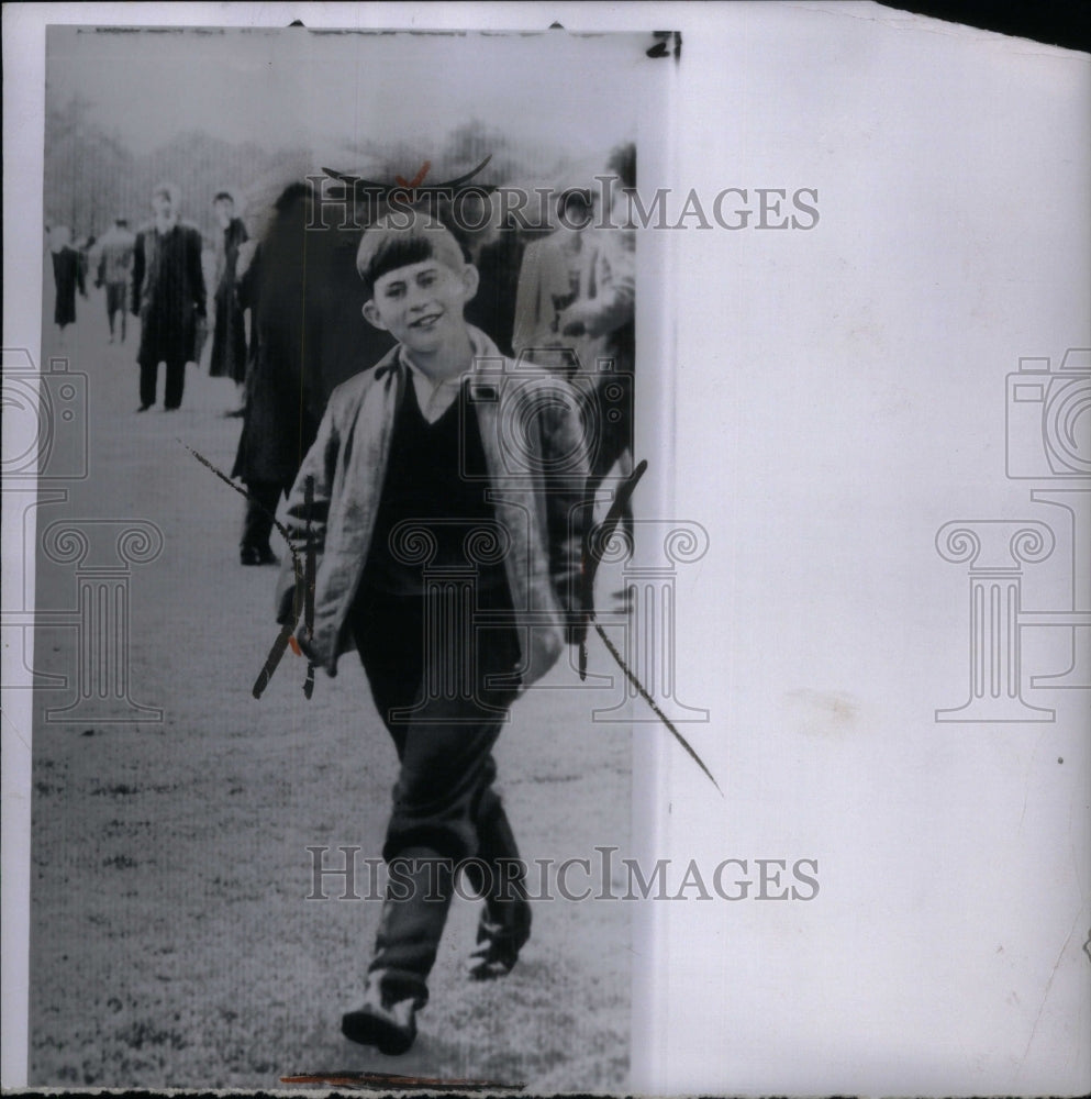 1959, Prince Charles wears rubber boots Grin - RRU45259 - Historic Images