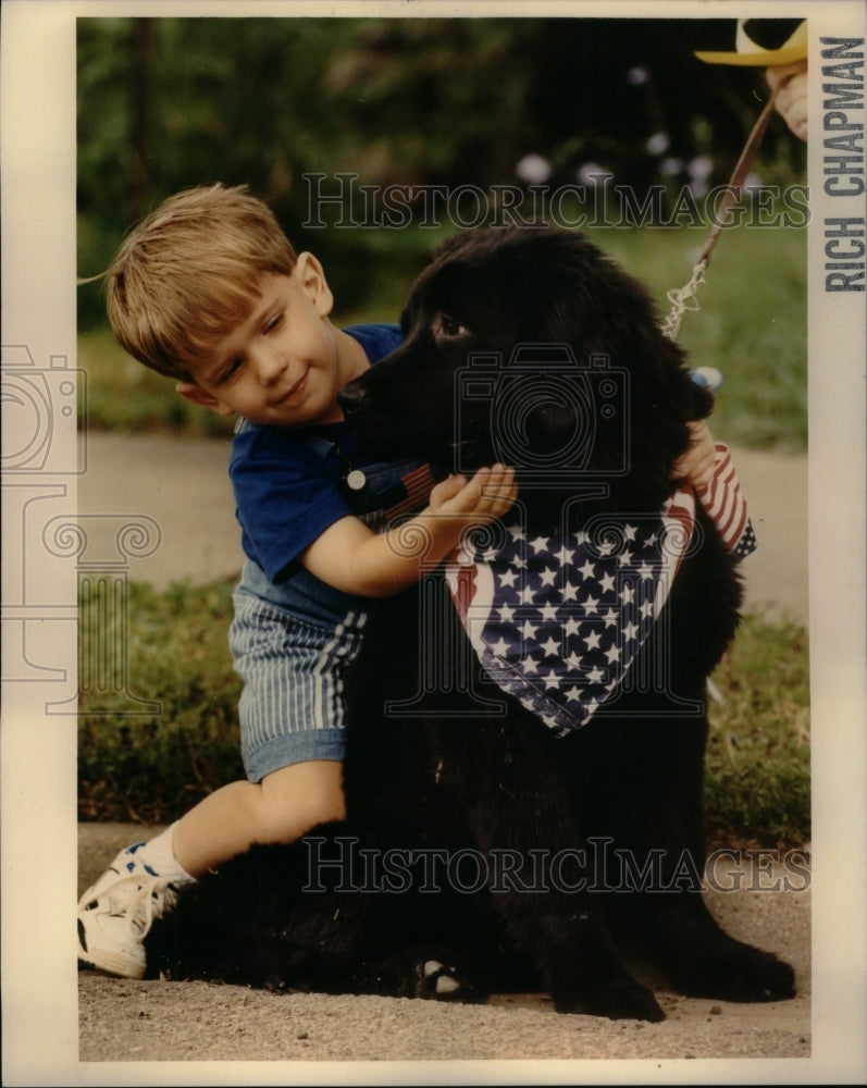 1991 Press Photo Child With Dog Fourth July Decorations - RRU49747 - Historic Images