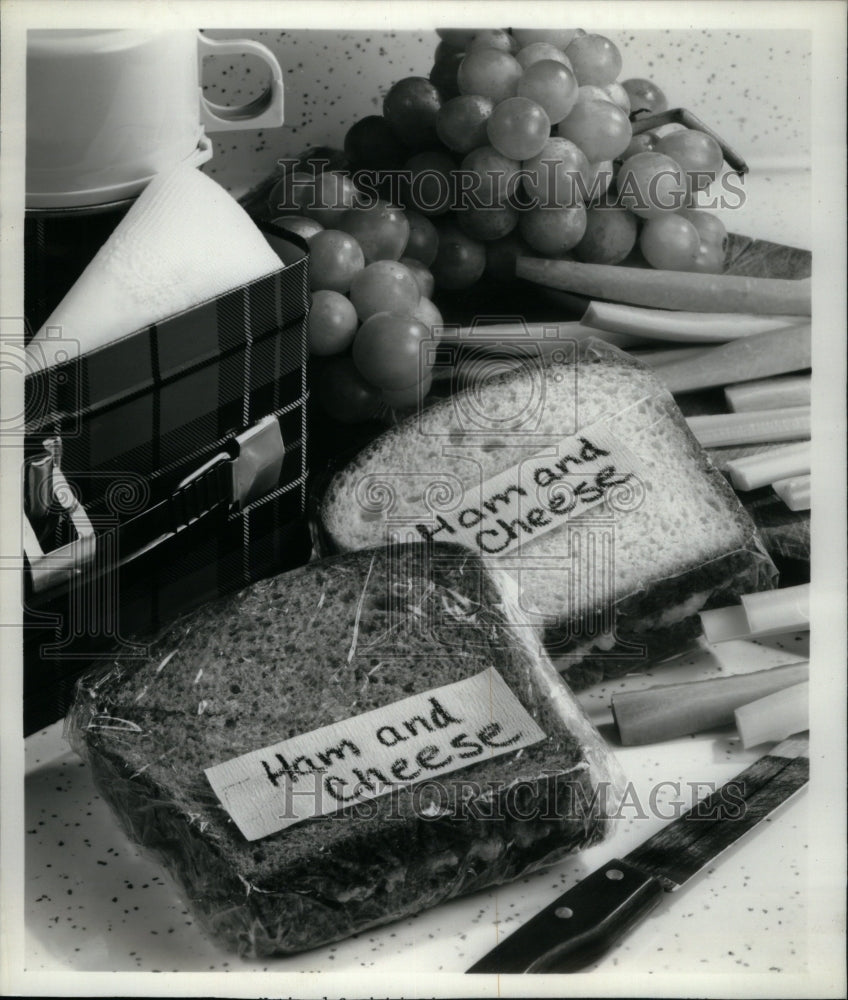 Press Photo Ham and Cheese Sandwiches and fruits. - RRU50799 - Historic Images