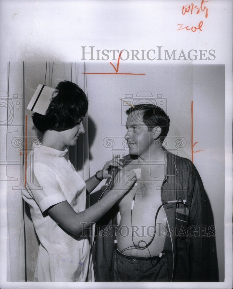 1968, Head Nurse Cardiac Department checks - RRU53715 - Historic Images