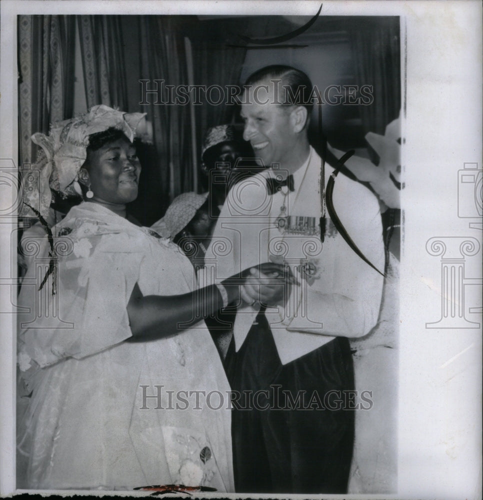 1961 Prince Phillip dances with Mrs. Mustap - Historic Images