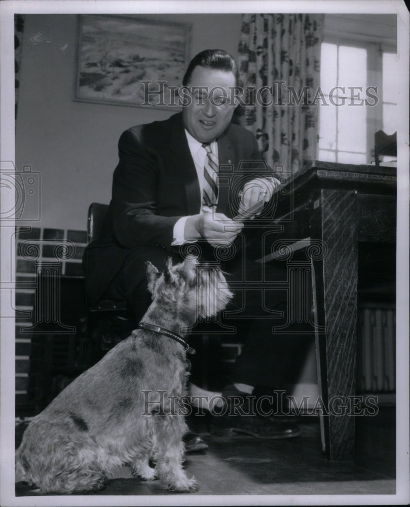 1957, W. R. &quot;Bill&quot; Jackson With Terrier - RRU57979 - Historic Images