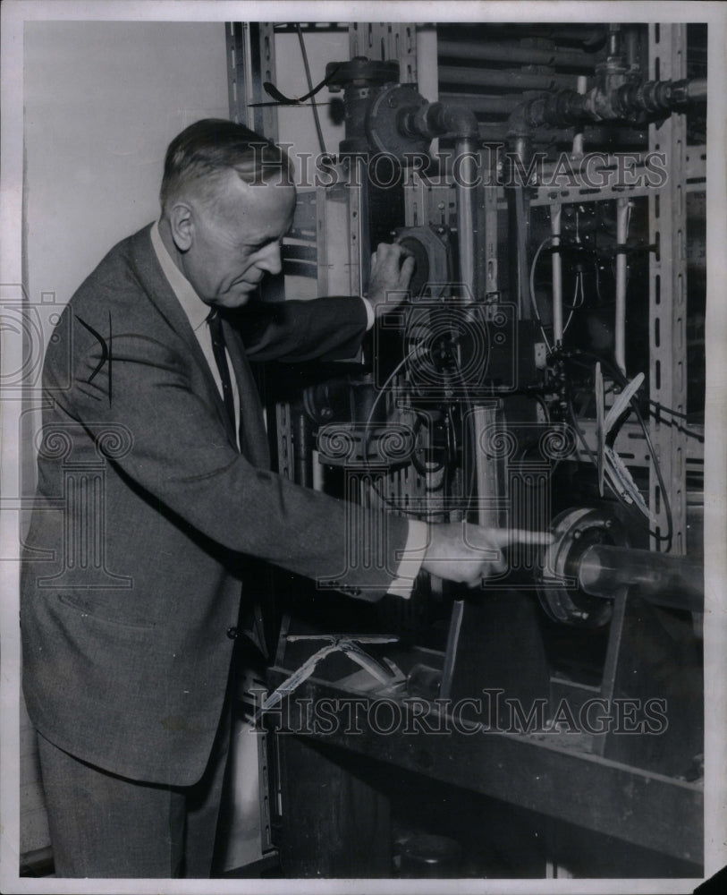 1954 Press Photo Douglas Dow, industrialist-examining - Historic Images