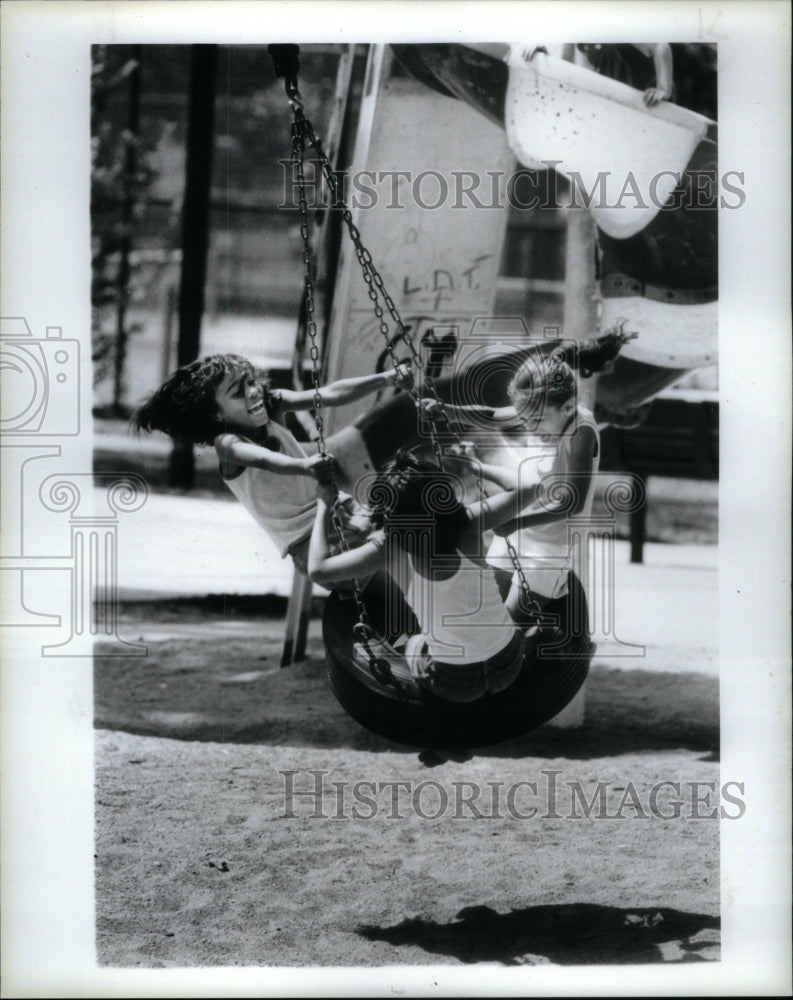 1985  Donna Beckwith girl swings Clark Park - Historic Images