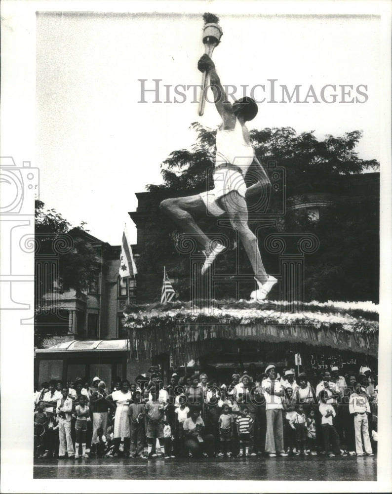 1980 Press Photo Black athlete carrying torch in parade - RRU65483 - Historic Images