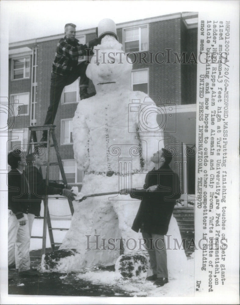 1960 Putting finishing touches snowman Tyft  - Historic Images