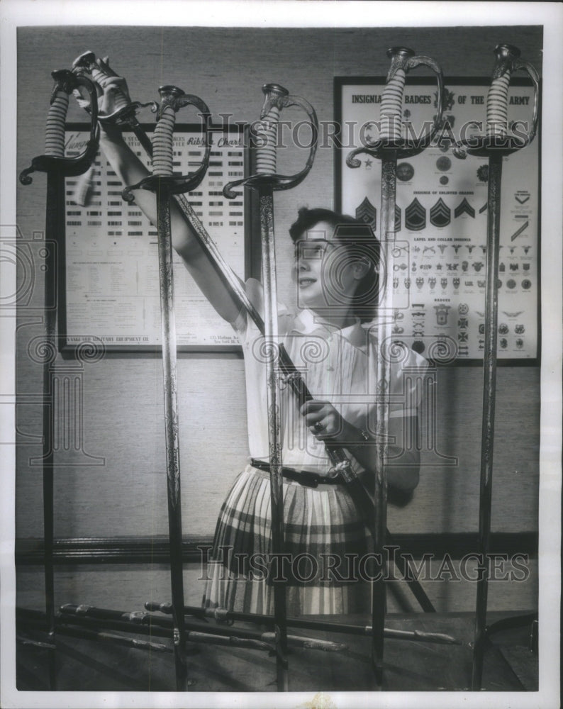 1954 Press Photo Carmen Borges Inspects Navy Swords - RRU75433 - Historic Images