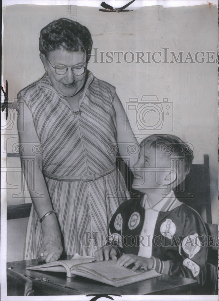 1957 Boy rescued from well,return to school-Historic Images