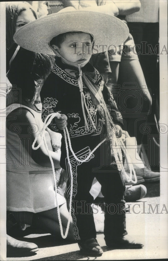 1973 cute boy at Mexican Parade in Chicago - Historic Images