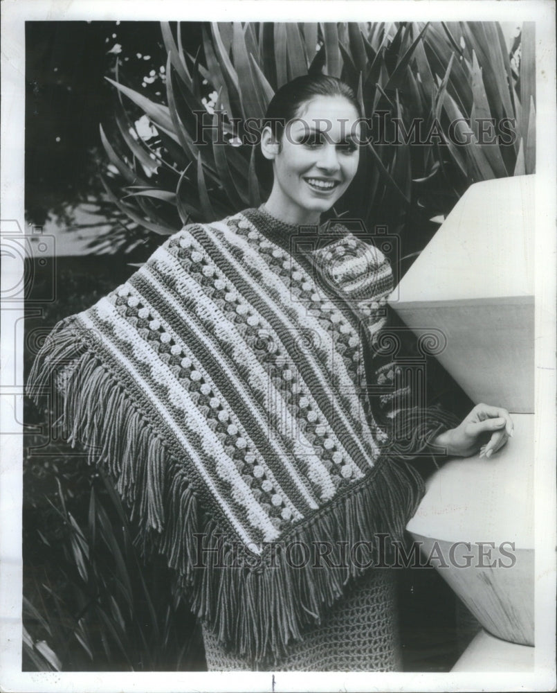 1971, A woman wearing crochet pattern poncho - RRU77323 - Historic Images