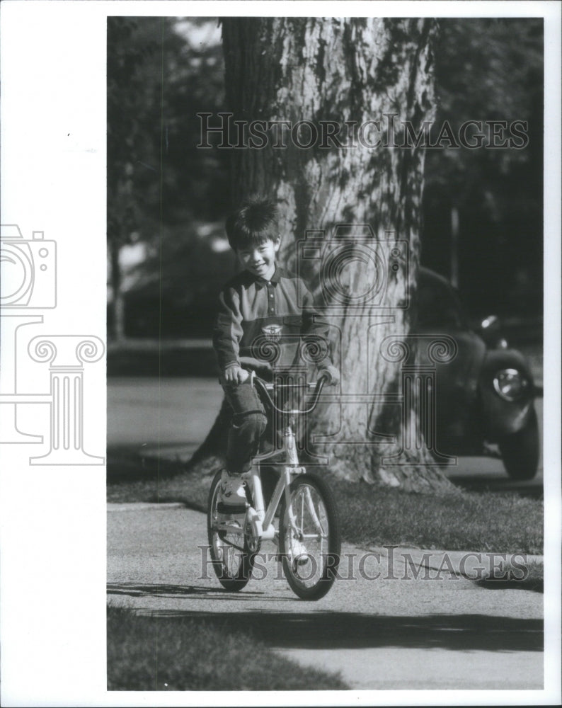 1988 Kids learning to ride their bikes - Historic Images