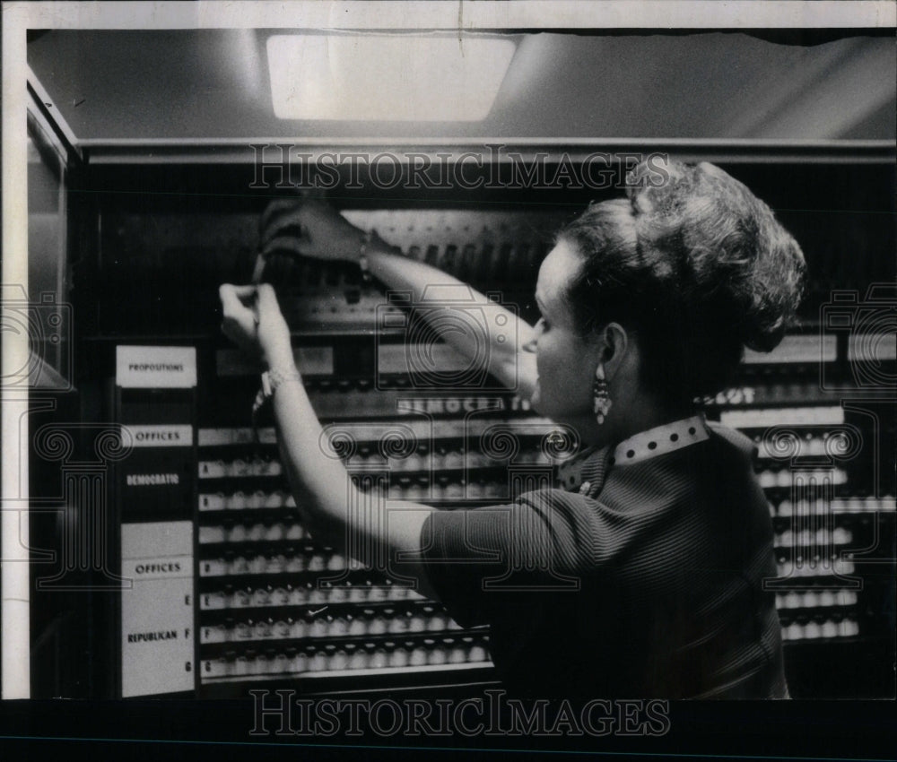 1968 Mrs. Jackie Knight and voting machine - Historic Images