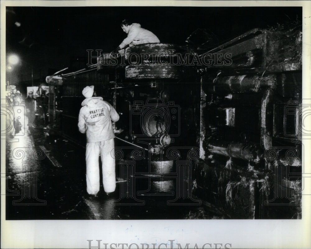 1983 Workers Pull Overturned Bus Upright - Historic Images