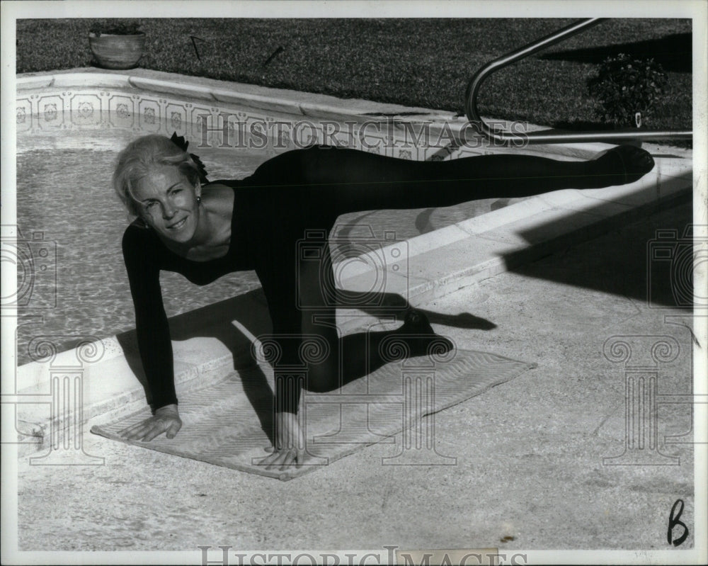 1981 Lady Doing Exercise Black Dress-Historic Images