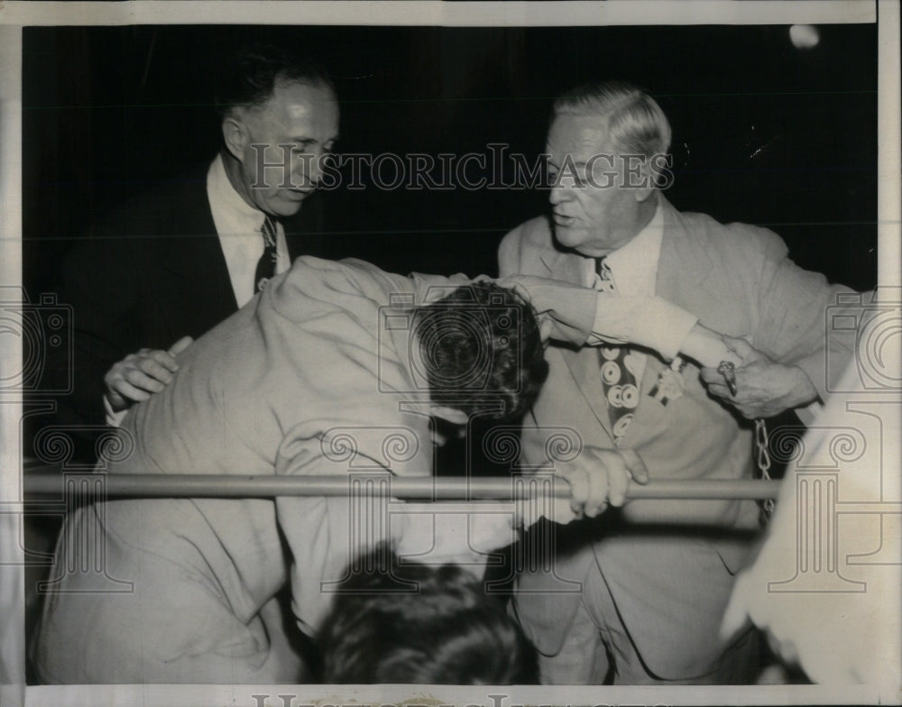 1952 Press Photo Douglas Aide Pushed Down In Speech - RRU98639 - Historic Images