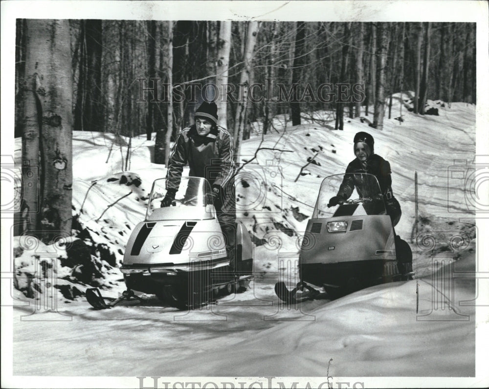 1971 People traveling snowmobile sweaters - Historic Images