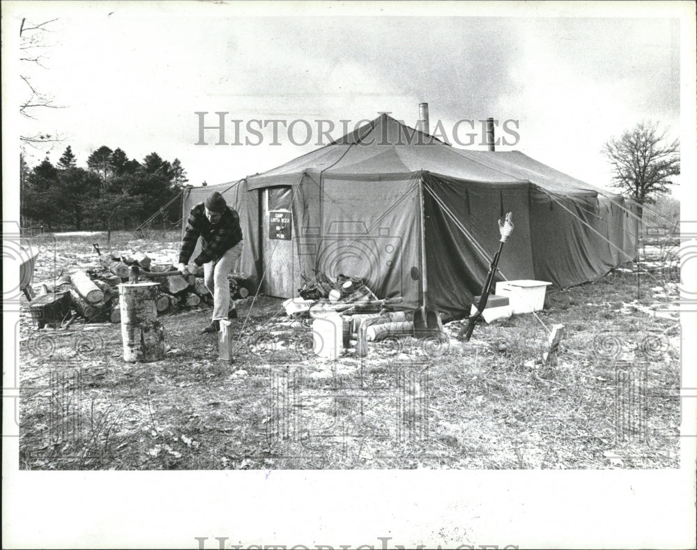 1979, Hunting deer hutch splitting wood - RRV02963 - Historic Images