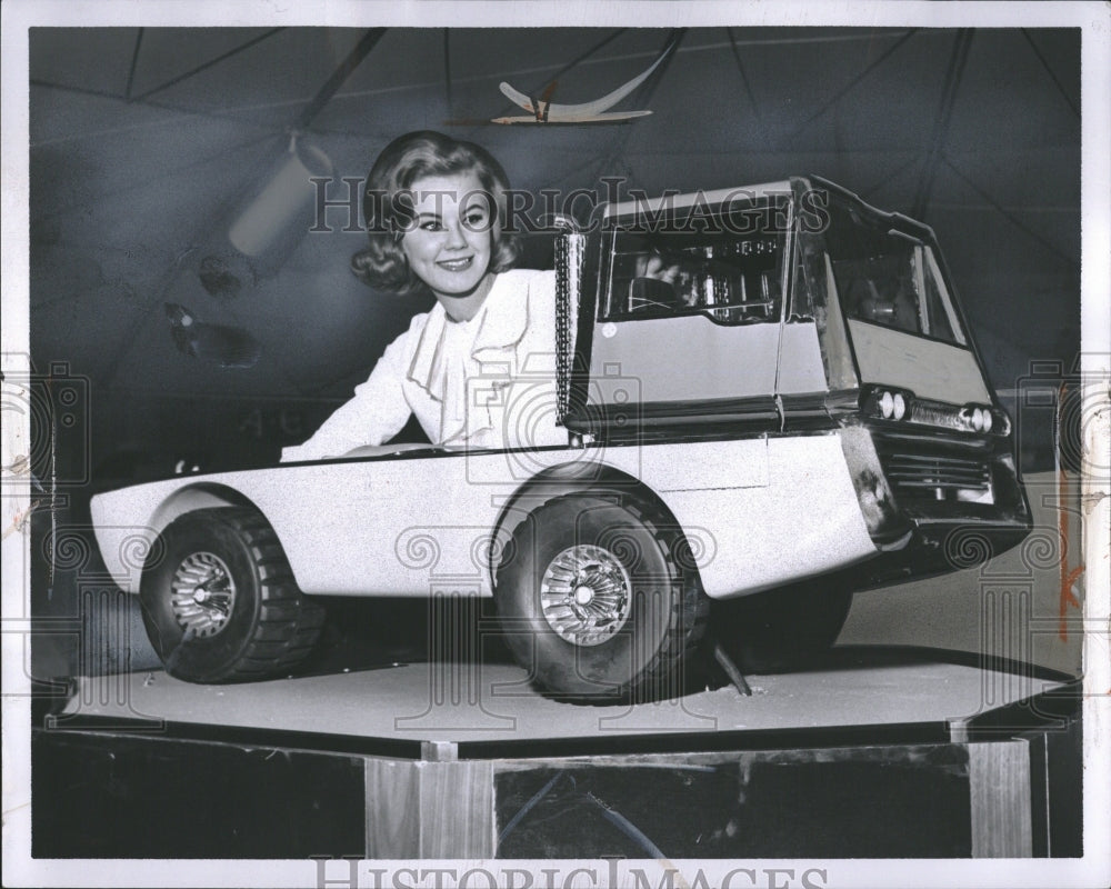 1964 Model Looks At Steel Car Model - Historic Images