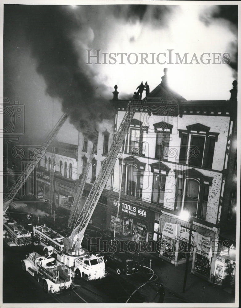 Press Photo Firefighters Trucks Business Complex - Historic Images