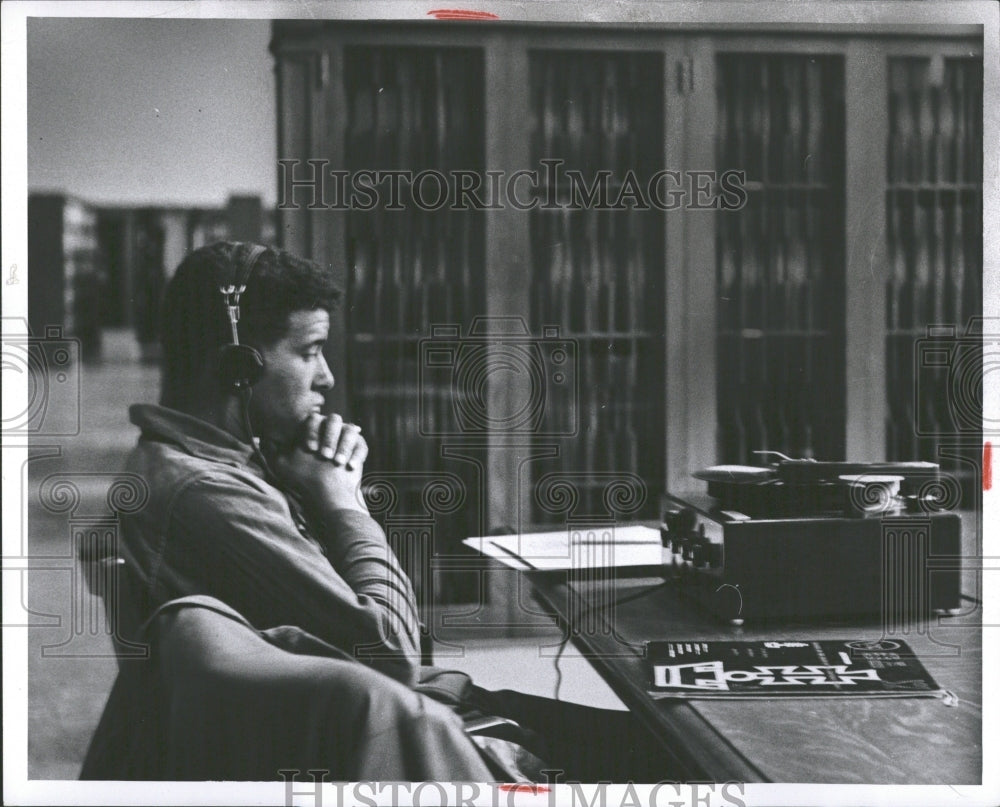 1955 Press Photo Man Earphones Main Library Detroit - RRV37155 - Historic Images