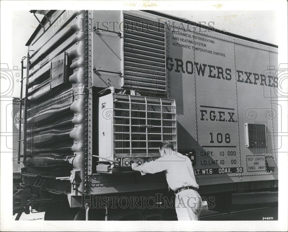 1955 Press Photo Fright refrigerator Man compressor - RRV41915 - Historic Images