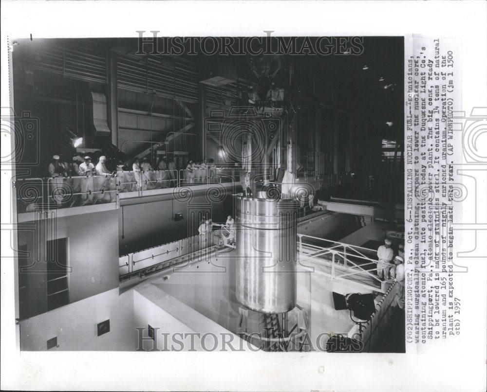 1957 Press Photo Nuclear Fuel Technicians clothinn core - RRV41993 - Historic Images