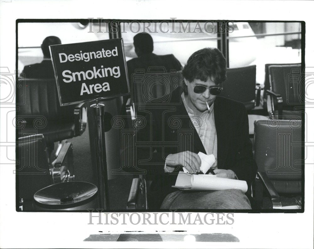 1990 O’Hare Airport Smoking area designated - Historic Images