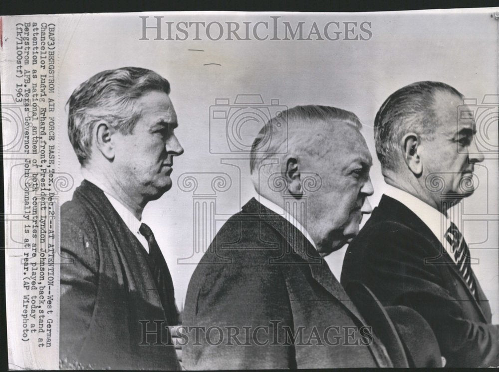 1963 Officials stand for national anthem - Historic Images