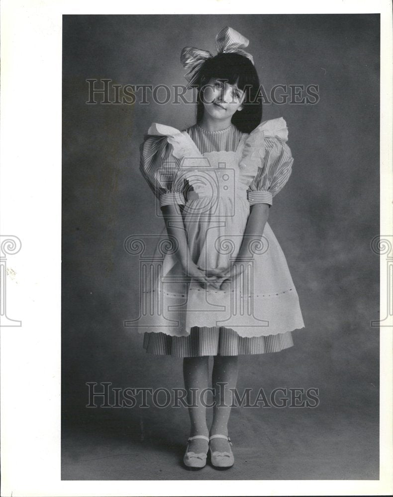 1991 Striped pinafore dress pleasant girl - Historic Images