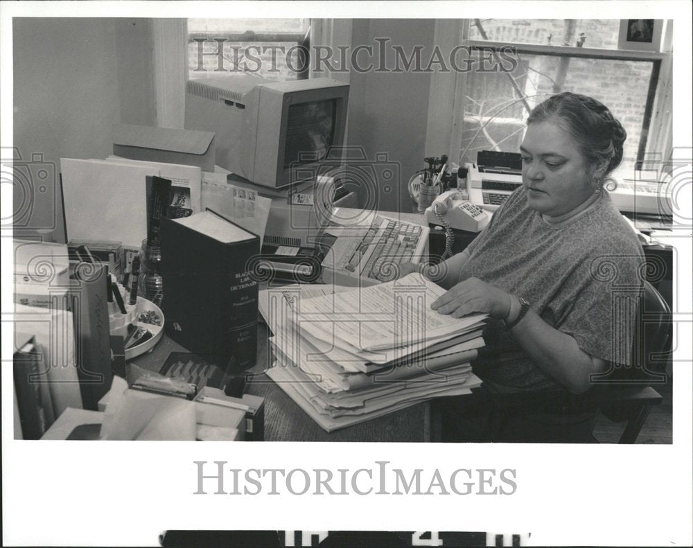 1993 Editor in office with piles of papers - Historic Images