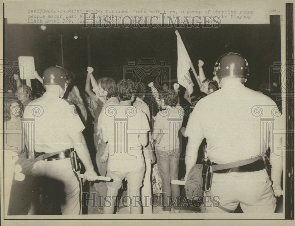 Press Photo Clinched Fists are Held High - Historic Images