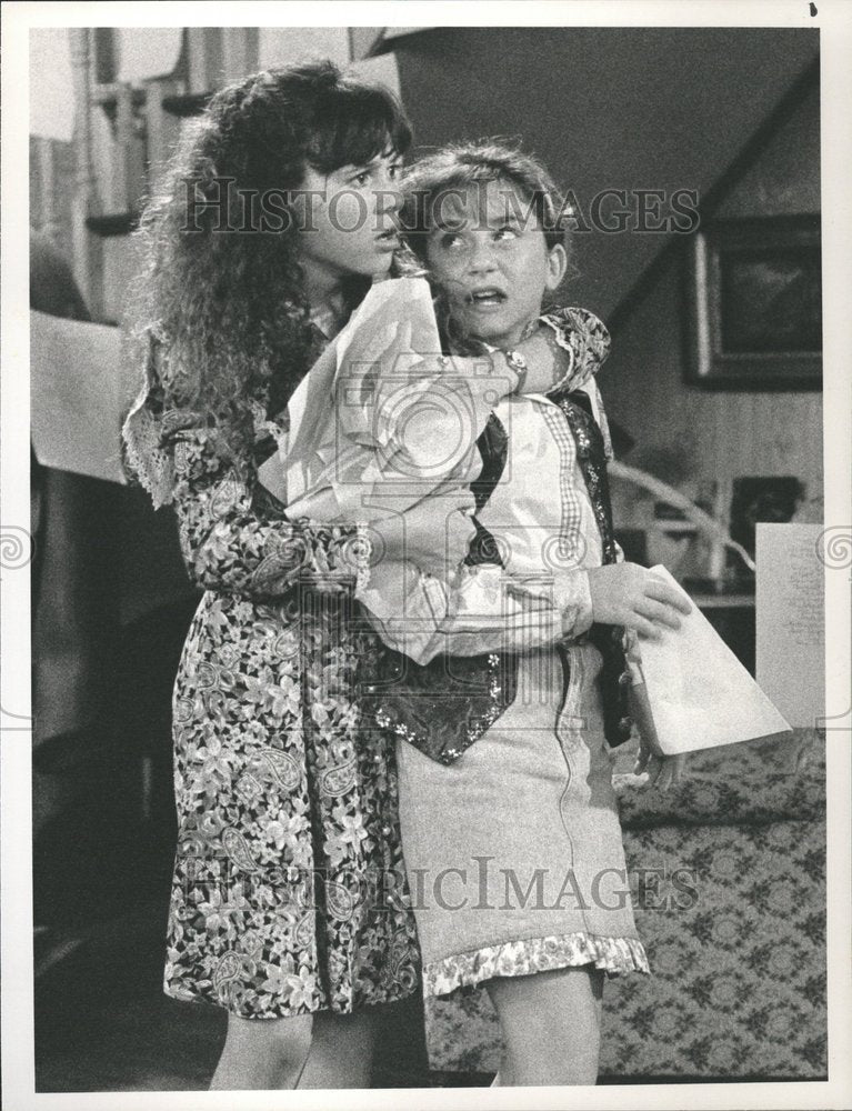 1991 Dorothy manhandles younger sister Ruth - Historic Images
