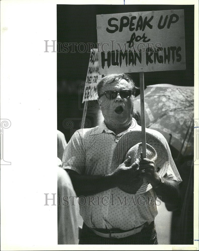 1983 Captive Nations Attendee Singing - Historic Images