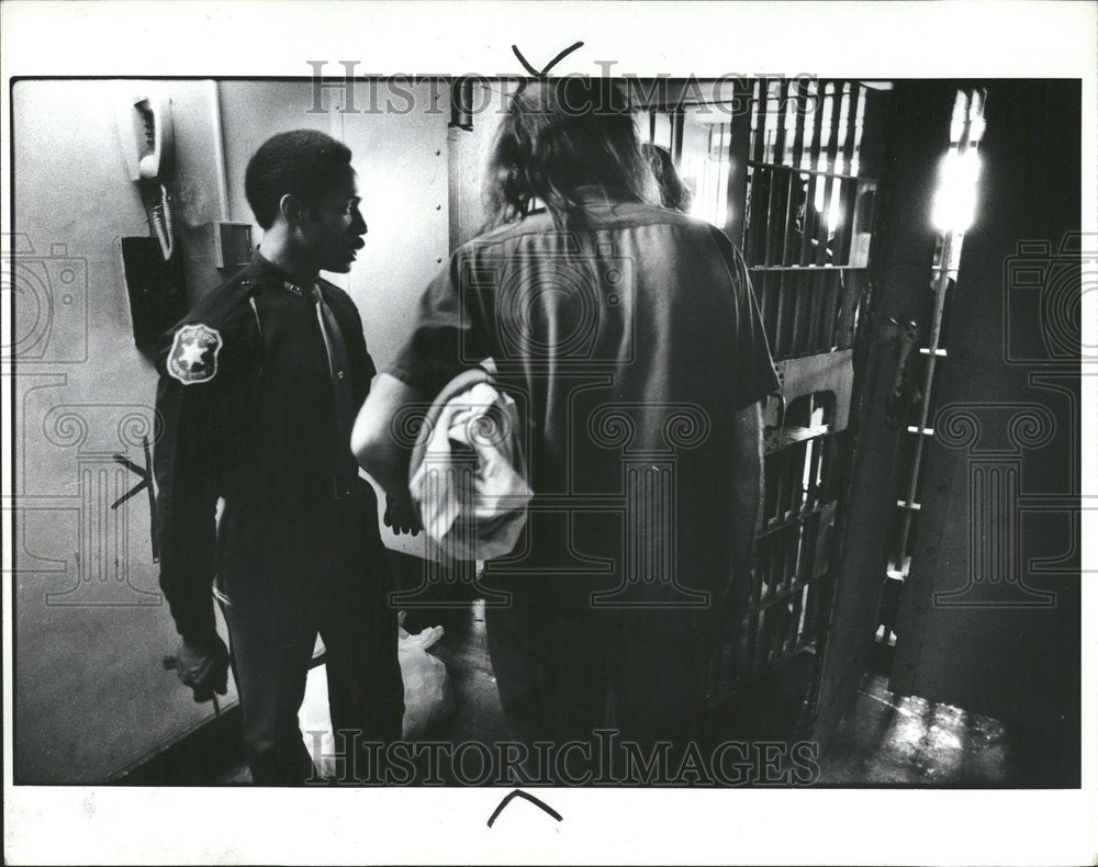 1981 Policeman Checking New Prisoners Jail - Historic Images