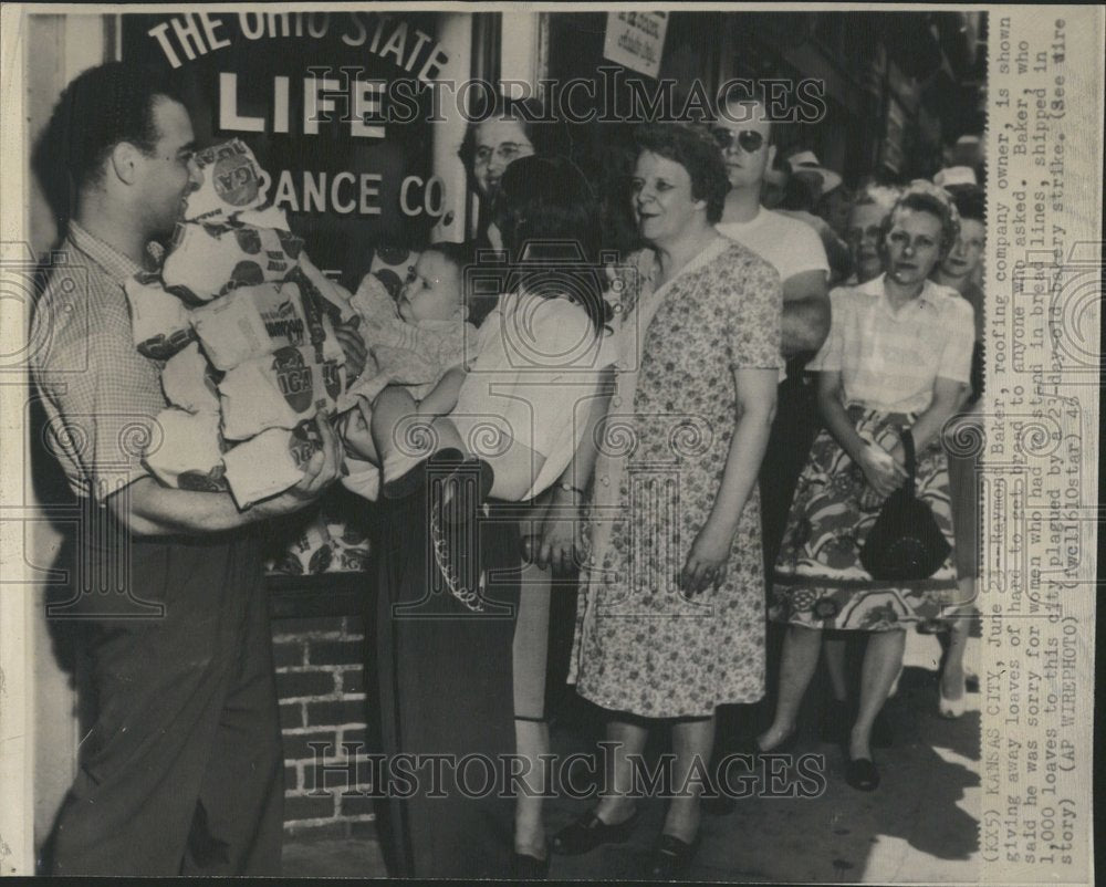 1946 Raymond Baker Gives Away Bread-Historic Images