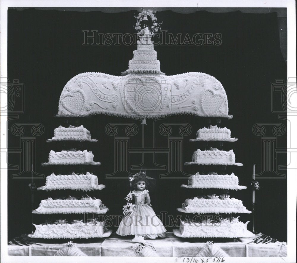 1961, Cake Doll Flowers - RRV76483 - Historic Images