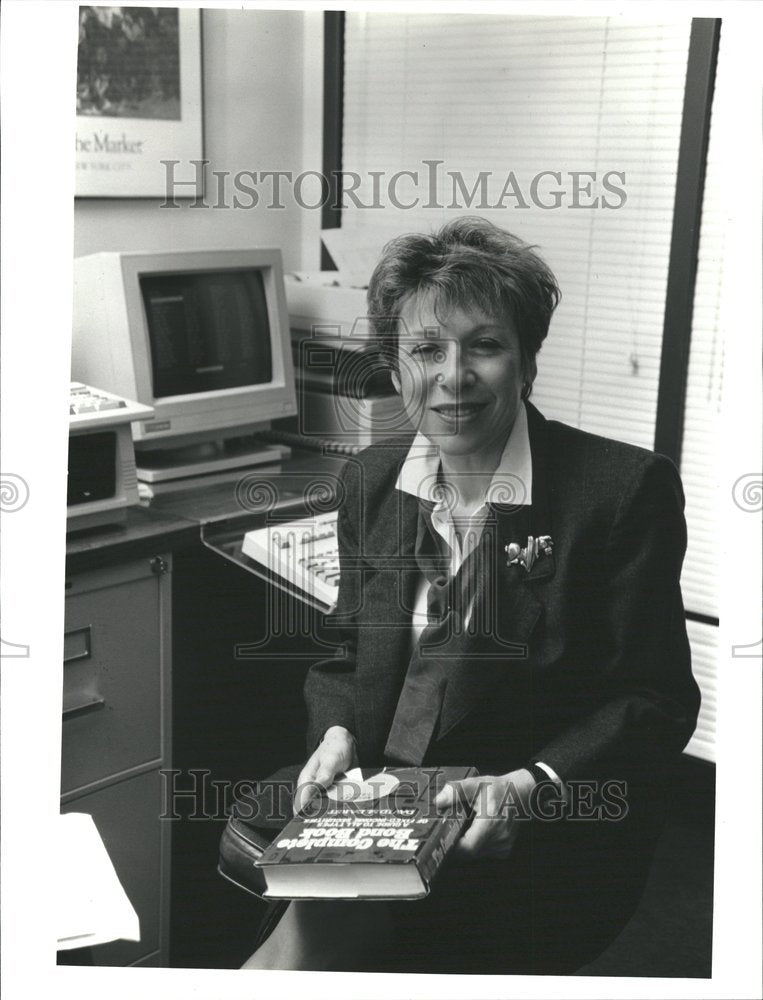 1992 Press Photo Marcelle Arak Holding Book In Office Historic