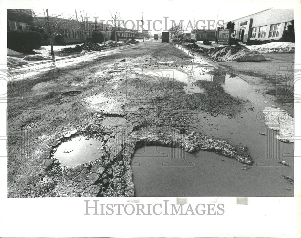 1979 potholes filled water Wilson motorists-Historic Images