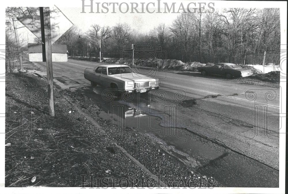 1979 gulch-like potholes form Golf Rd.-Historic Images