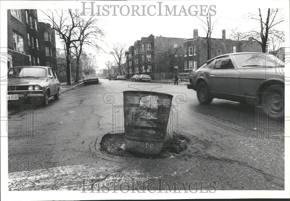 1979 pothole waste basket stuffed Coles - Historic Images