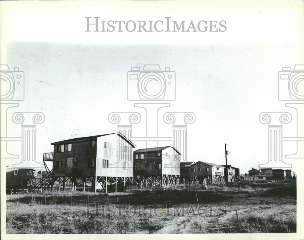 1985, Houses On Stilts Flood Protection - RRV95261 - Historic Images