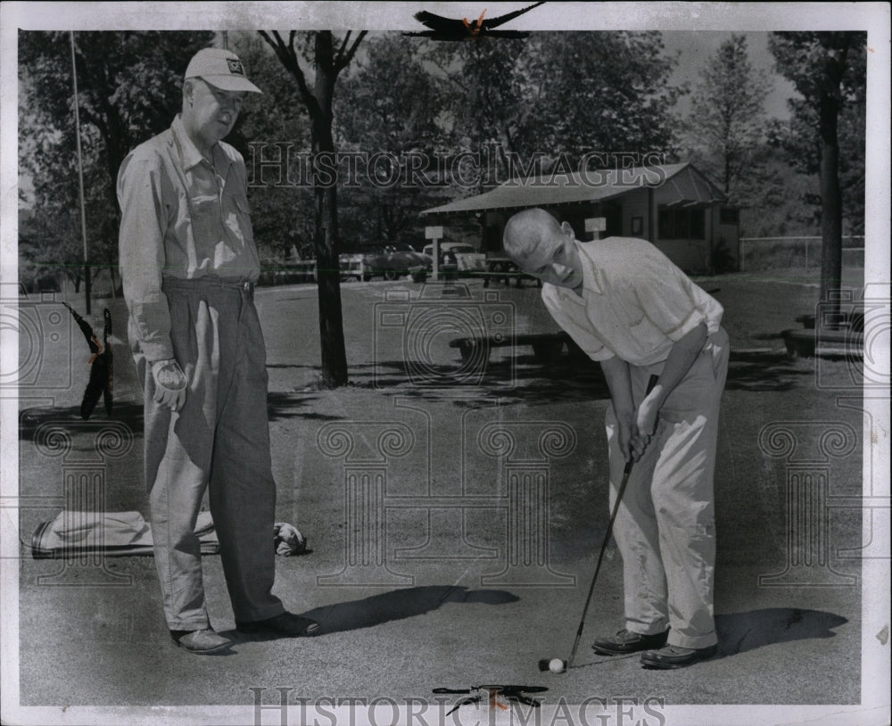 1957 Press Photo Lew Thomas, Fred Holt practice Golf. - RRW00187 - Historic Images
