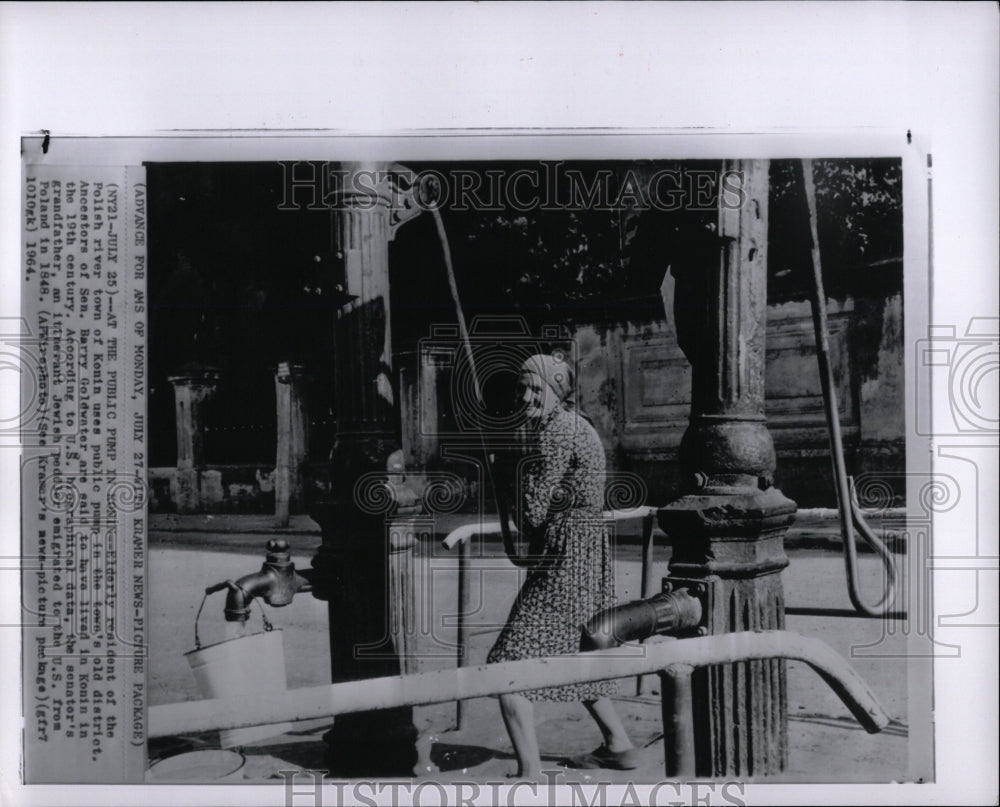 1964 Press Photo Poland Public Pump Woman Resident - RRW03149 - Historic Images